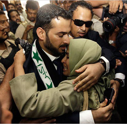 Muntadher al-Zaidi with his sister after being freed from prison in 2009.