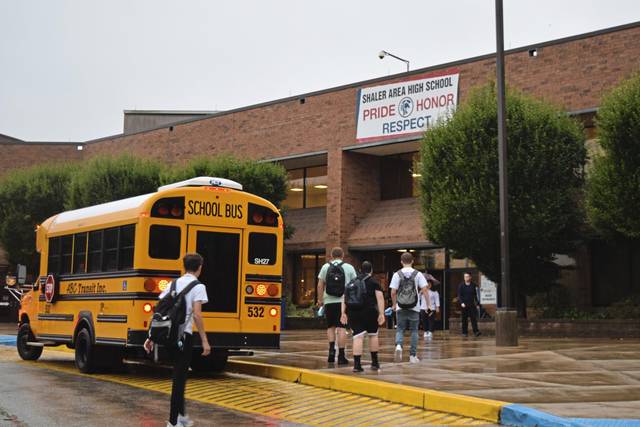 Students make their way to the main entrance at Shaler Area High School. 