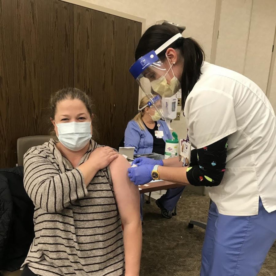 Mrs. Jessica Wilson, SAES nurse, getting one of the doses of the COVID-19 vaccine. 
