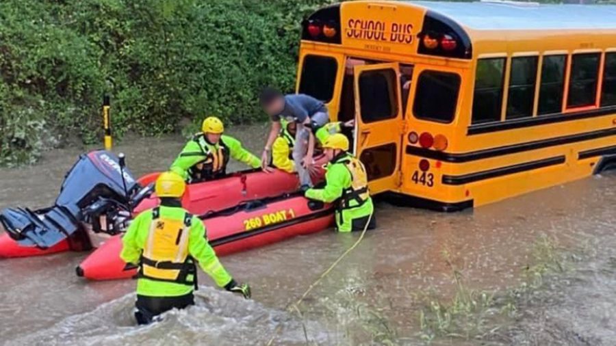 Shaler Area students are rescued from their school bus which stalled in a flash flood