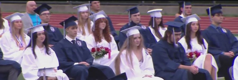 A scene from Shaler Area graduation ceremony in June 2021 with traditional blue and white cap and gowns being worn. 