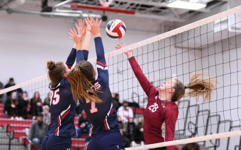 The Titans and Oakland Catholic battle at the net in the WPIAL semifinals. 