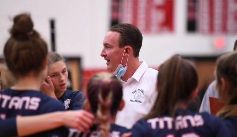 Paul Stadelman talks with the girls volleyball team during a playoff match vs Oakland Catholic. 