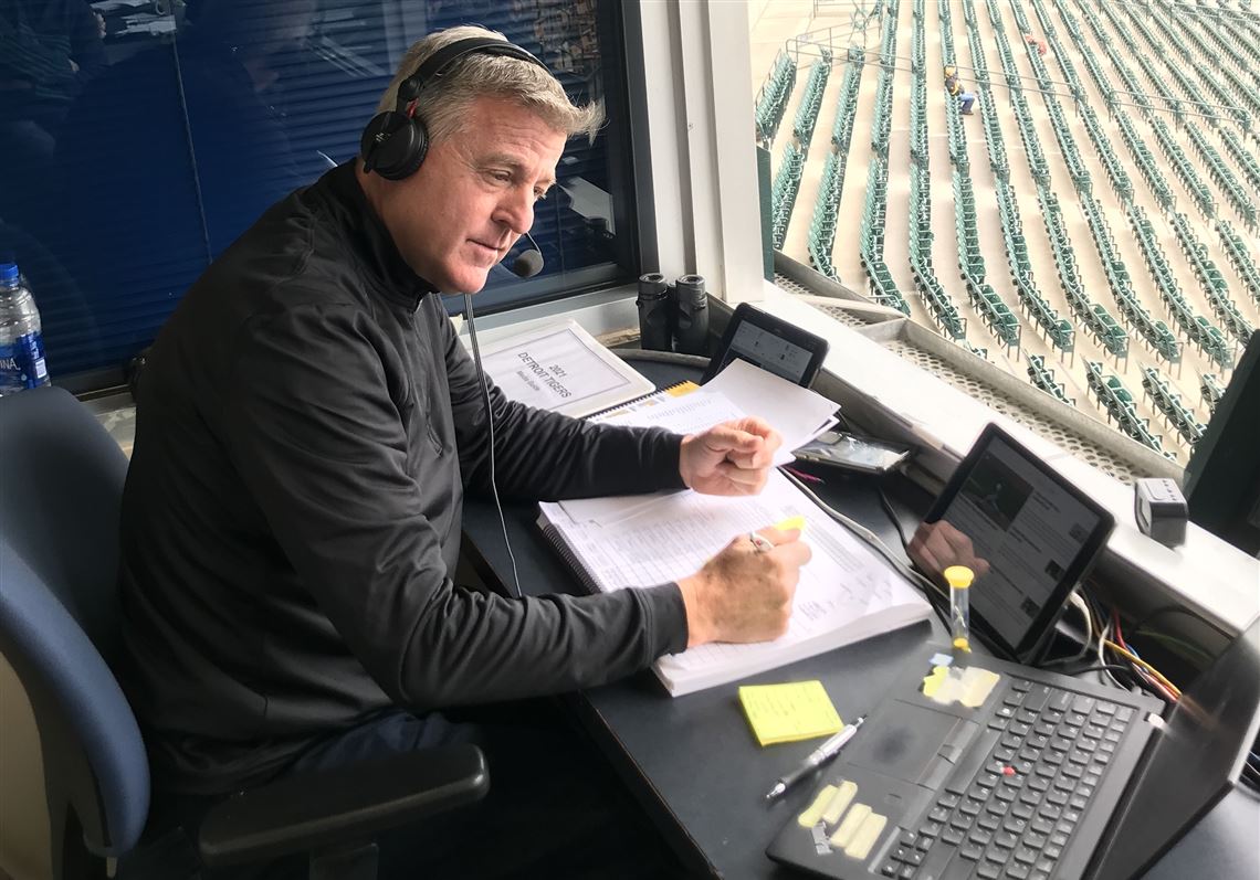 Greg Brown preparing for a Pirates in the broadcast booth in Detroit