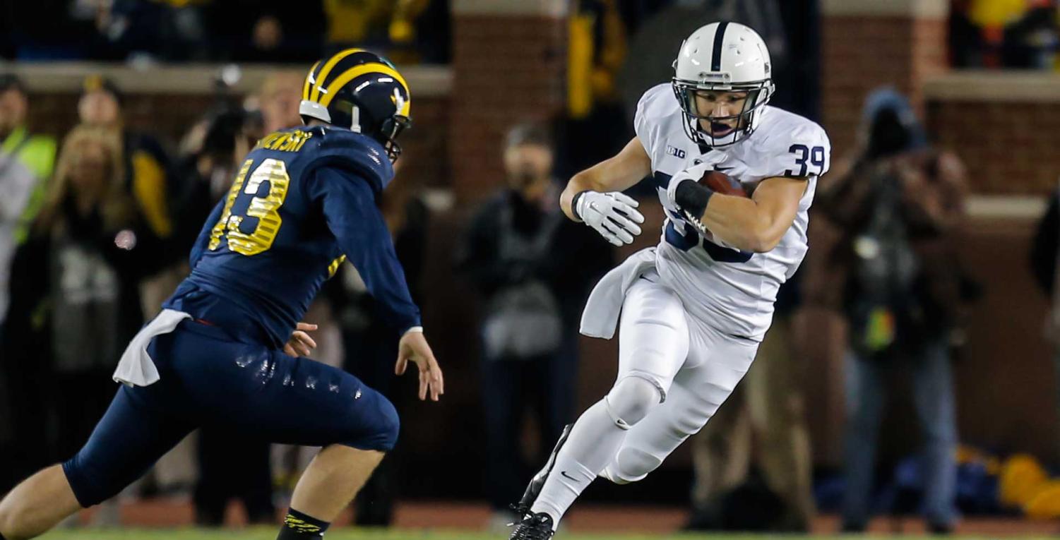 Jesse Della Valle, SA class of 2010, returns a punt against Michigan. 