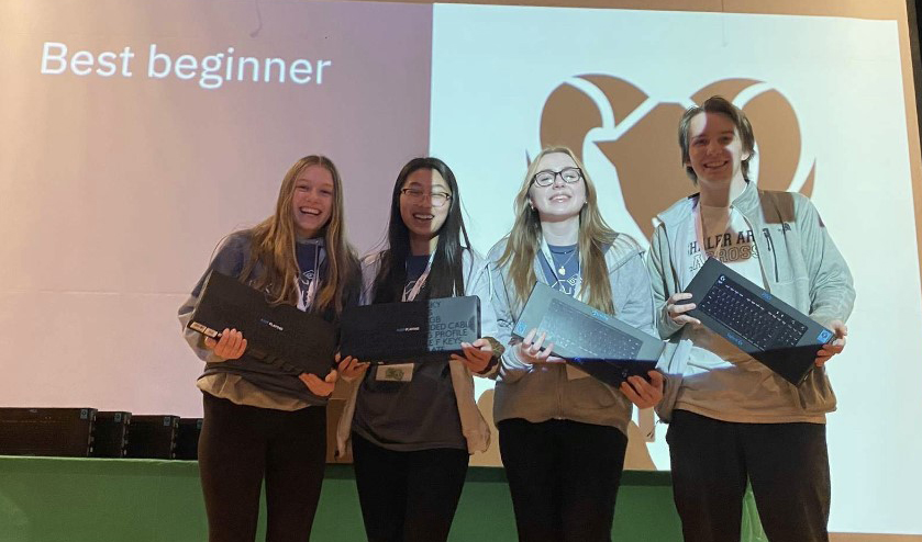 Jordan Geidel, Alice Yang, Danielle Berdik, and Tyler Lienemann with their Best Beginner award at Pine Richland coding competition. 