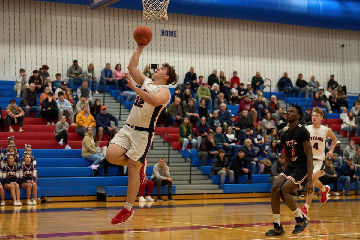 Brandon London (#32) makes a layup in the boys basketball team's victory over Bethel Park 79-29