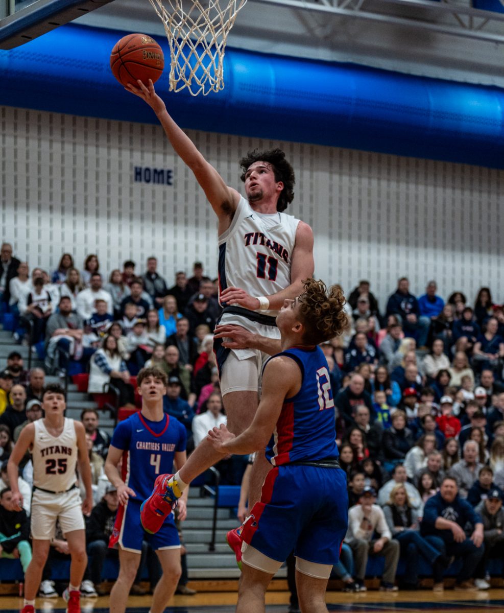 Sam Himrod attempts a layup in the Titans’ 73-71 victory over Chartiers Valley in the First Round of the WPIAL Playoffs.