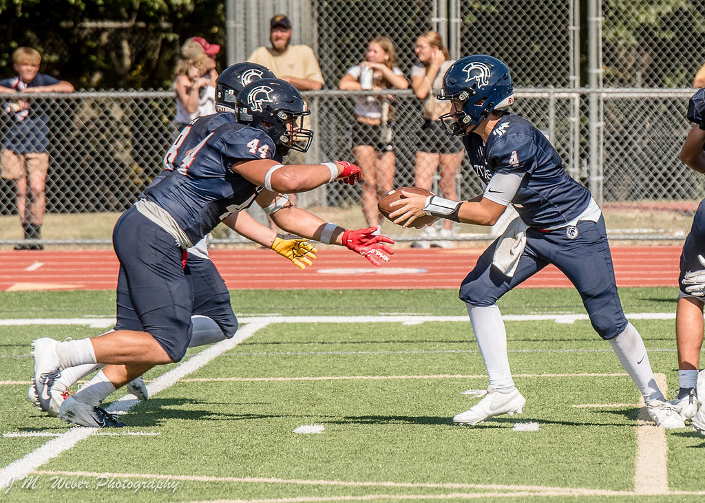 Sami Tapu takes a handoff in the Homecoming game vs Woodland Hills