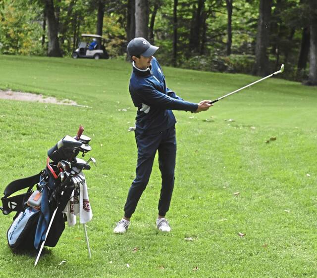 Jacob Crissman hits a chip shot at Champion Lakes Golf Course during the 2022 WPIAL tournament. (Paul Schofield - TribLive)