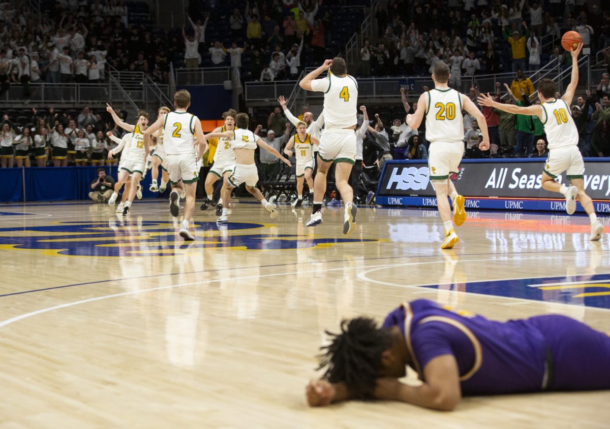 Deer Lakes players celebrate their 61-60 victory against OLSH in the WPIAL Class 3A championship on Friday, March 3, 2023, at Petersen Events Center. OLSH's Dereon Greer can be seen laying on the court after the down-to-the-buzzer defeat.